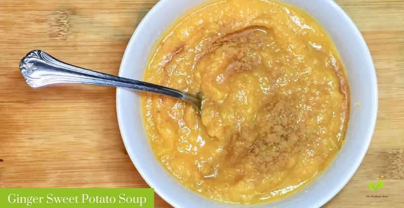 Ginger sweet potato soup in a white bowl with a silver spoon | The Radiant Root