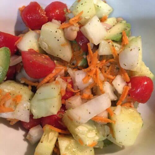 Garlic Cucumber Salad with cherry tomatoes, yellow onions, shredded carrots, avocado, cannellini beans olive oil and wildtree garlic galore | The Radiant Root