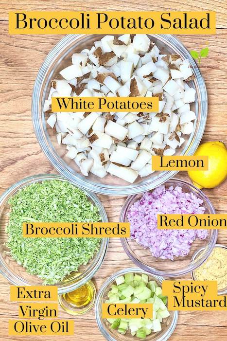 Broccoli Potato Salad ingredients in glass bowls on a wooden table white potatoes, lemon juice, shredded broccoli, red onion, olive oil, celery, spicy mustard| The Radiant Root