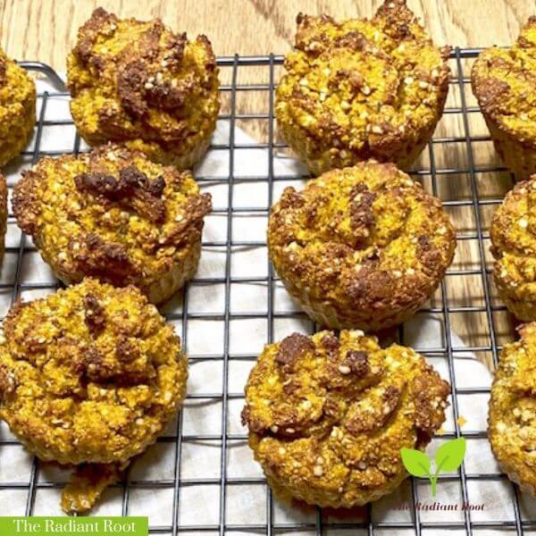 Protein Pumpkin Muffins Cooked on a wire rack and a white towel | The Radiant Root