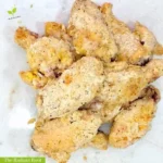 GF Chicken Wings WP Recipe Photo: A close up of finished almond flour coated chicken wings on a white marble cutting board | Substitute for almond flour | The Radiant Root